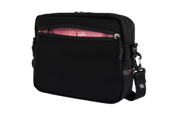 The Side Kick in Black Ballistic with an Sakura (pale pink with white grid) 200 Halcyon interior.